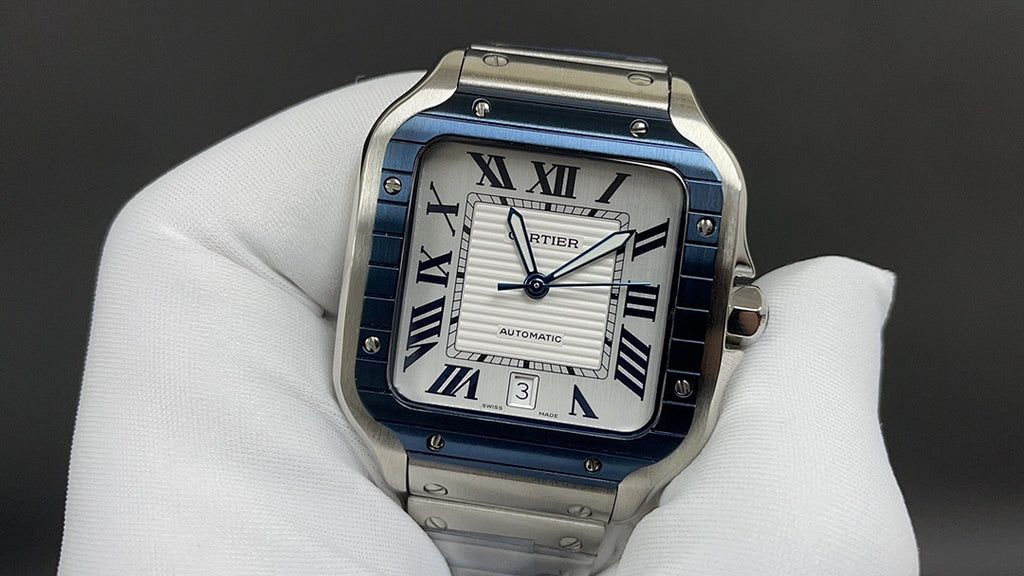 Cartier watch with blue Roman numeral dial, square face, stainless steel strap
