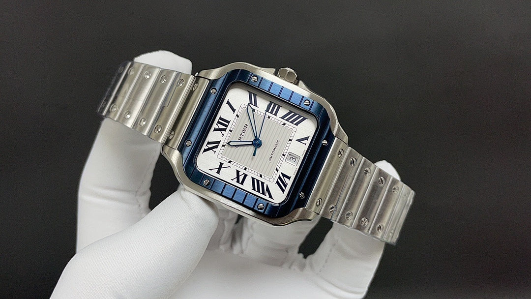 Square stainless steel Cartier watch with blue accents and Roman numeral dial on bracelet