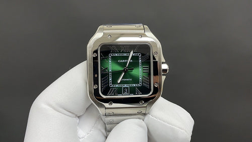 Cartier watch with green dial, black bezel, Roman numerals, steel bracelet