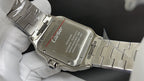 Cartier watch case on steel bracelet, engraved dial plate visible