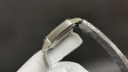 Cartier watch with steel bracelet, angled side view of polished case