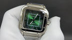 Cartier watch with green dial and Roman numerals, steel case and bracelet