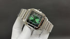 Cartier watch with green dial, Roman numeral markers, steel bracelet close view