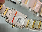 Two-tone wristwatch caseback with engraved panel and small gold-toned components