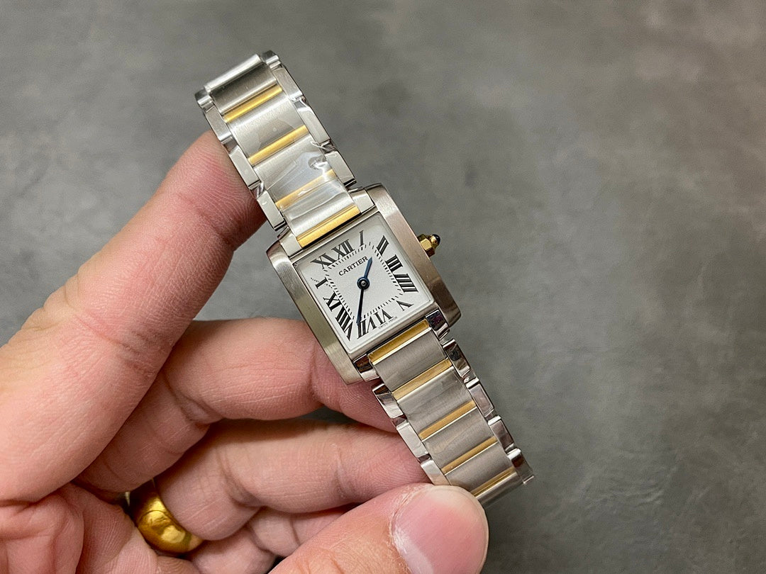 Two-tone wristwatch front view, white dial with Roman numerals and gold-toned crown