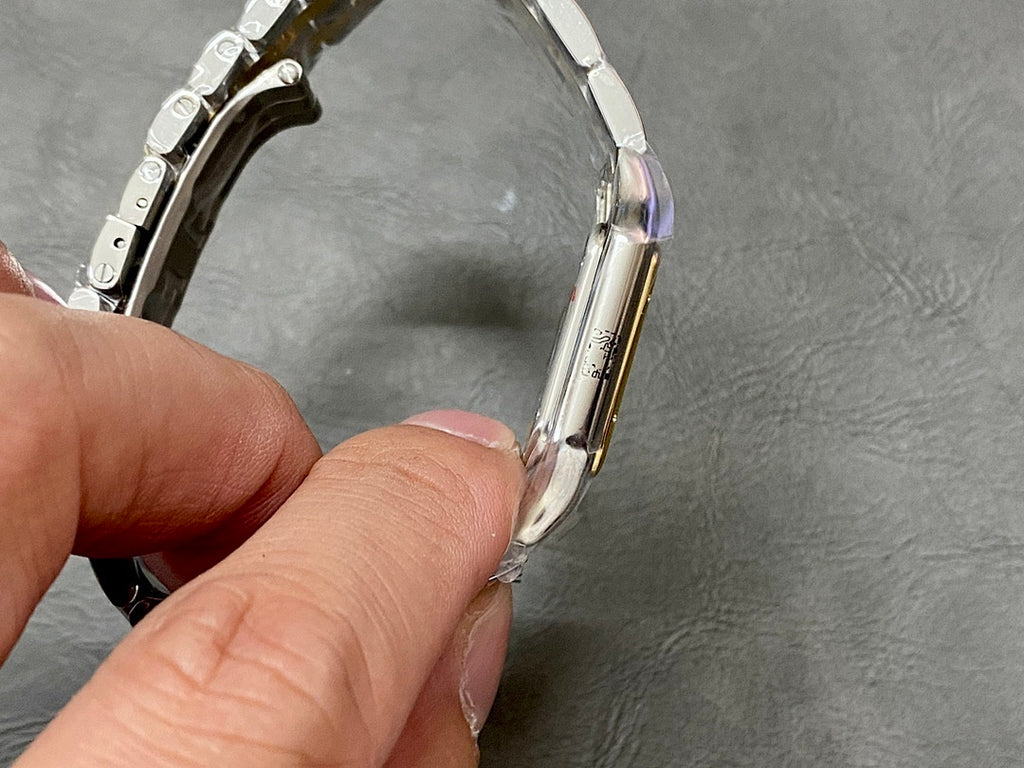 Cartier watch side profile with metal links and clasp hardware
