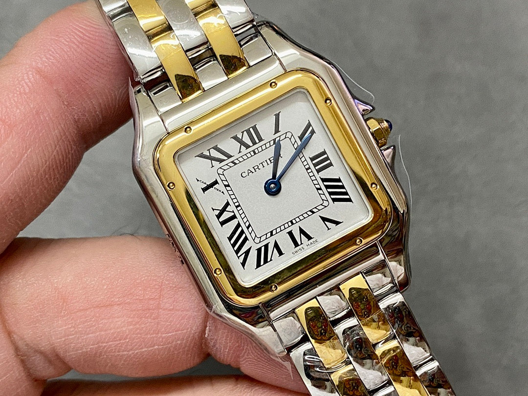 Cartier watch close-up showing white dial, roman numerals, and blue minute hand