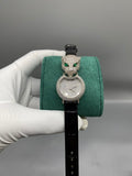 Cartier watch with black leather strap and jeweled round dial with green cat motifs