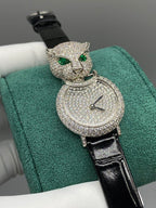 Cartier watch with green cat head and diamond-studded round dial, black strap