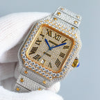 Diamond-set rectangular watch with gold dial, blue hands, silver strap with gold accents