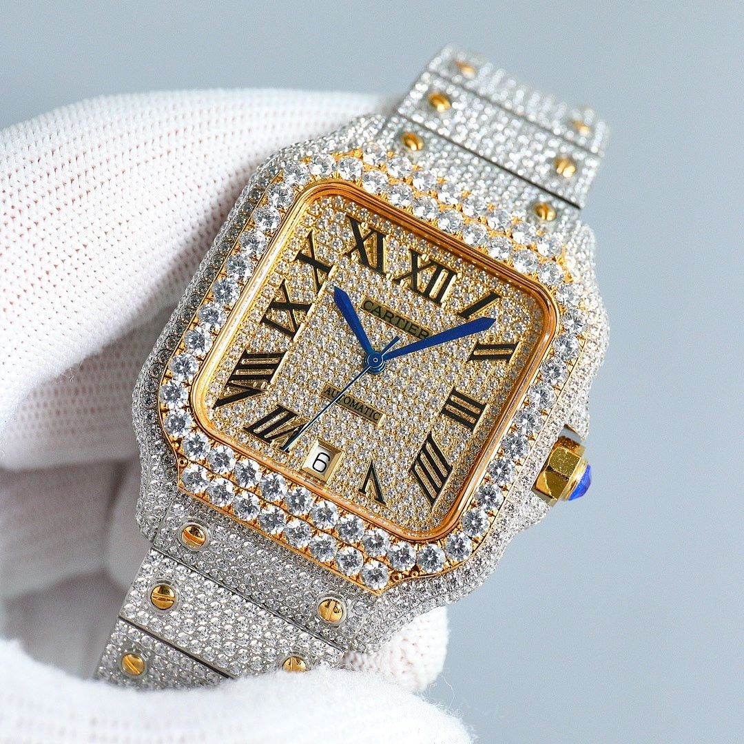 Diamond-set rectangular watch with gold dial, blue hands, silver strap with gold accents