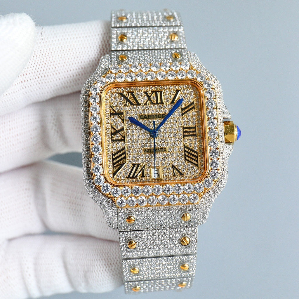 Rectangular diamond wristwatch with gold dial, Roman numerals, silver bracelet strap