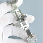 Cartier watch underside, metal case and clasp, jeweled silver link bracelet.