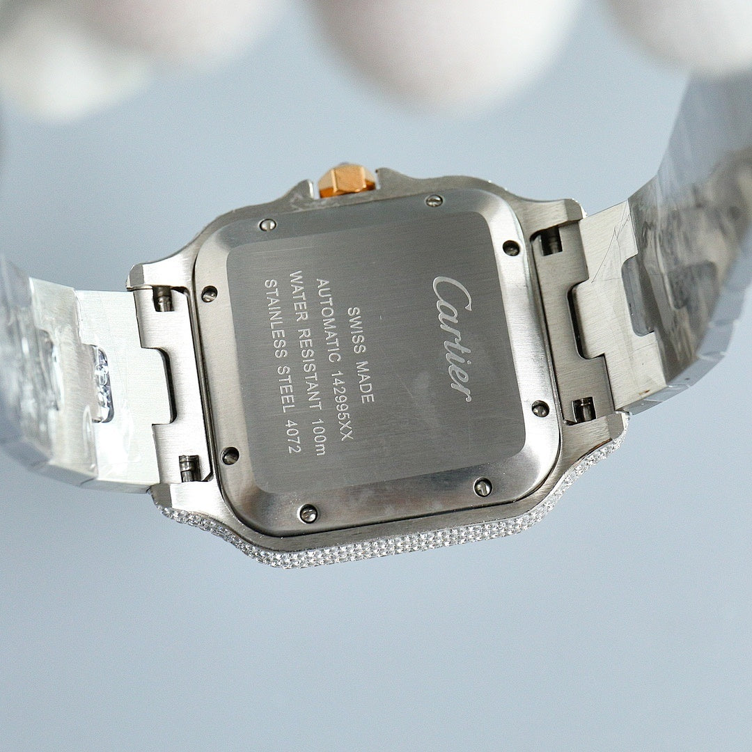 Cartier watch case back with Cartier branding, diamond-set bezel, silver bracelet links.