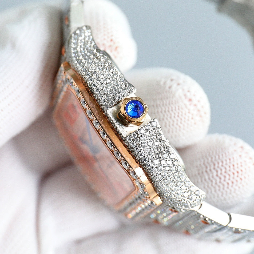 Cartier watch side view, jeweled silver bracelet, gold crown with blue gem detail.