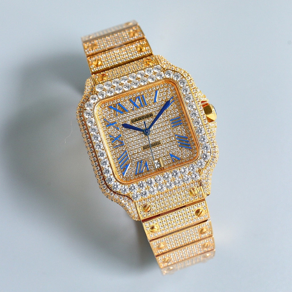 Cartier square wristwatch with blue Roman numerals, glittering diamond bezel, gold link bracelet