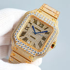 Cartier square wristwatch close-up showing blue Roman numerals, diamond bezel, and gold case outline