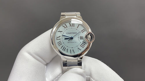 Cartier automatic wristwatch with silver dial, Roman numerals, and steel bracelet