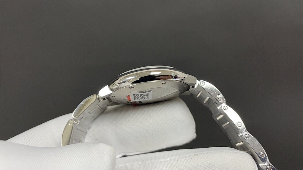 Cartier automatic wristwatch side view with crown and steel bracelet links