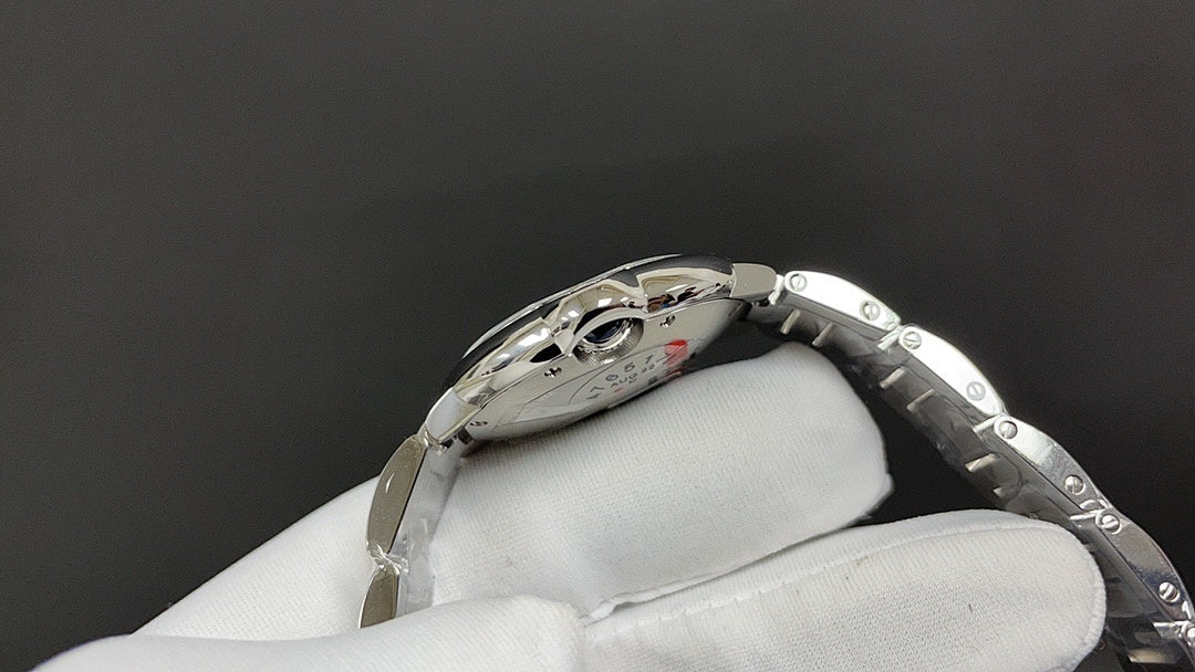 Cartier automatic wristwatch angled view showing engraved case and bracelet