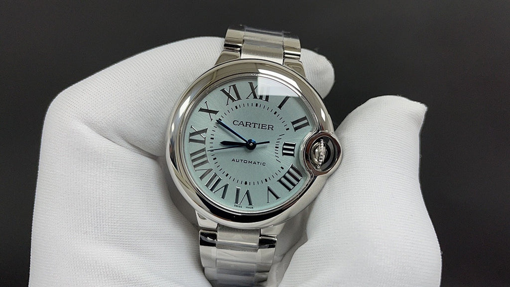 Cartier automatic wristwatch with light blue dial, Roman numerals, steel bracelet