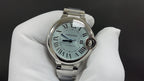Cartier automatic wristwatch with light blue dial, Roman numerals, steel bracelet
