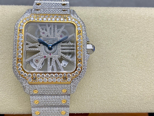 Square dial diamond watch with silver bracelet, gold pin accents, crown at side