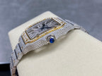 Silver diamond bracelet watch with rectangular bezel and blue cabochon accent