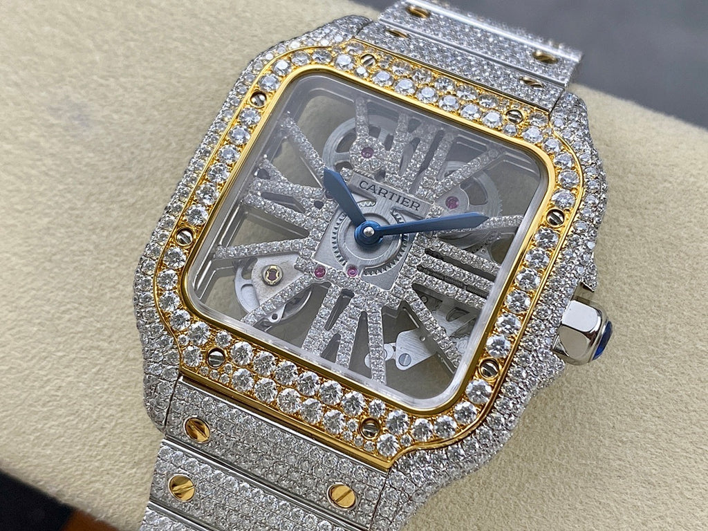 Square dial diamond watch with silver strap, gold border, and blue hands