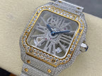 Square dial diamond watch with silver strap, gold border, and blue hands