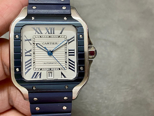 Cartier men’s watch with silver case, white face, Roman numerals, blue leather strap