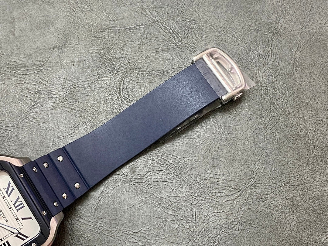 Blue leather watch strap with metal buckle clasp on a silver-toned keeper