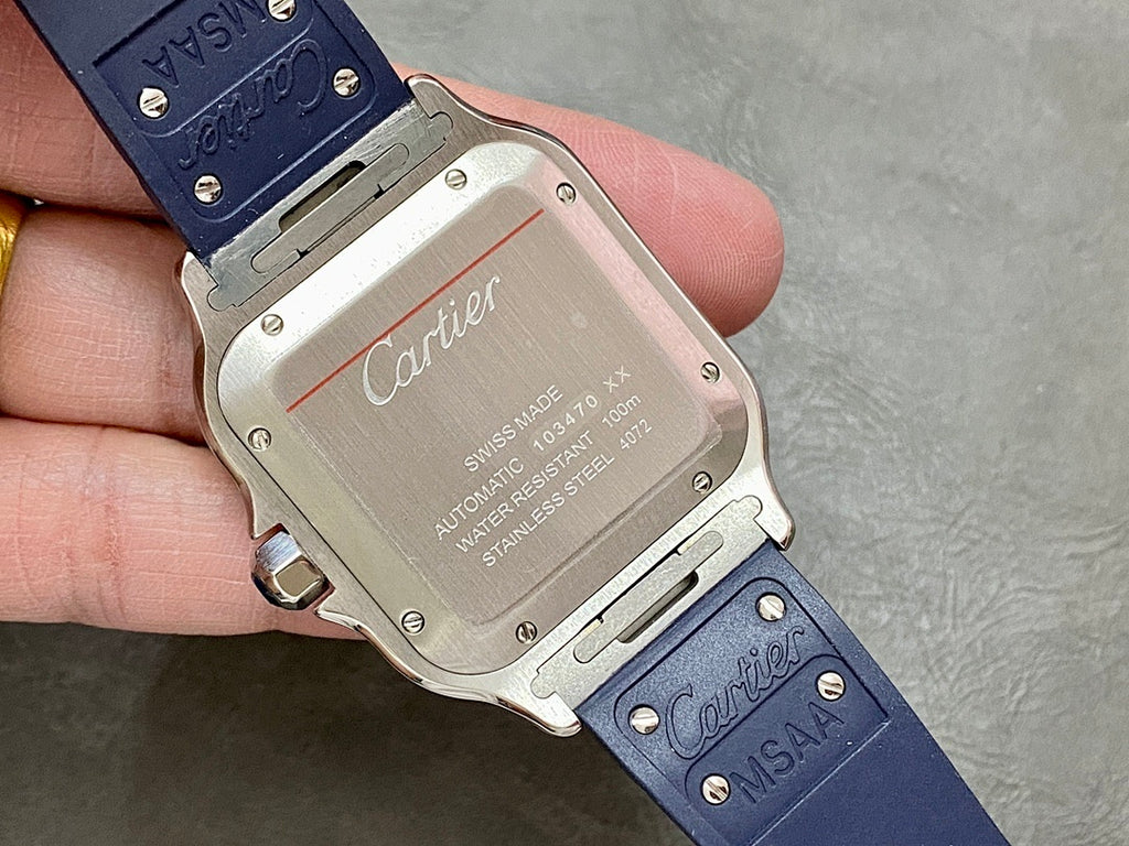 Cartier watch case back with Swiss Made text and blue leather strap with stamped marking