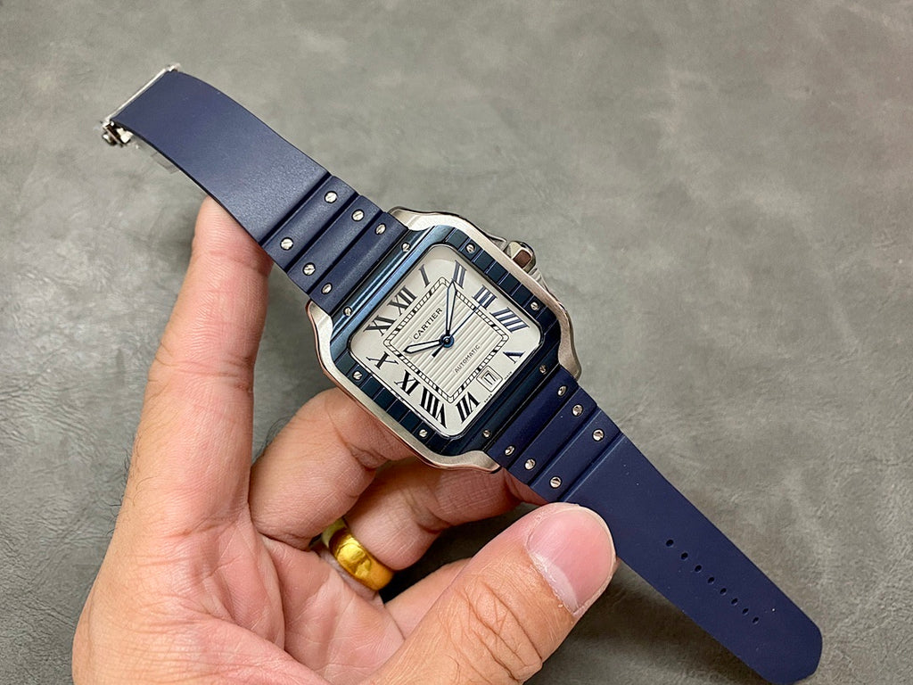 Cartier watch on blue leather band with silver case and Roman numeral dial
