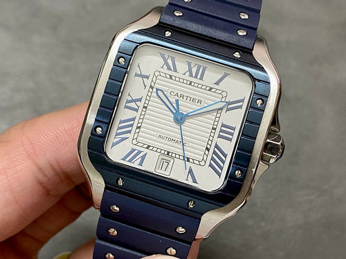 Cartier men’s watch with silver case, white dial, Roman numerals, blue studded strap