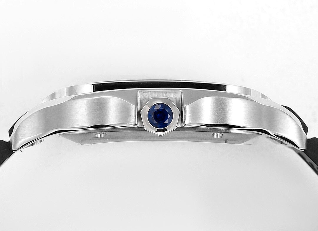 Cartier watch bezel with blue sapphire-like crown accent, silver-toned case.