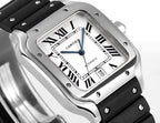 Cartier watch with black rubber strap, silver-toned case, white dial with blue hands.