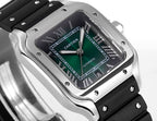 Cartier watch with black rubber strap, silver-toned square case, green-accent dark dial.