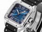 Cartier watch with blue dial, Roman numerals, silver case, black rubber strap
