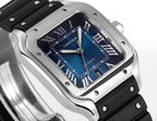 Cartier watch with blue Roman numeral dial, silver case, black rubber strap