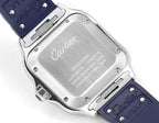 Cartier watch caseback in silver with Cartier logo and blue strap