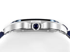 Cartier watch with silver case and blue cabochon crown, blue strap