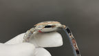 Cartier watch case with polished silver-tone finish and jeweled bezel edge