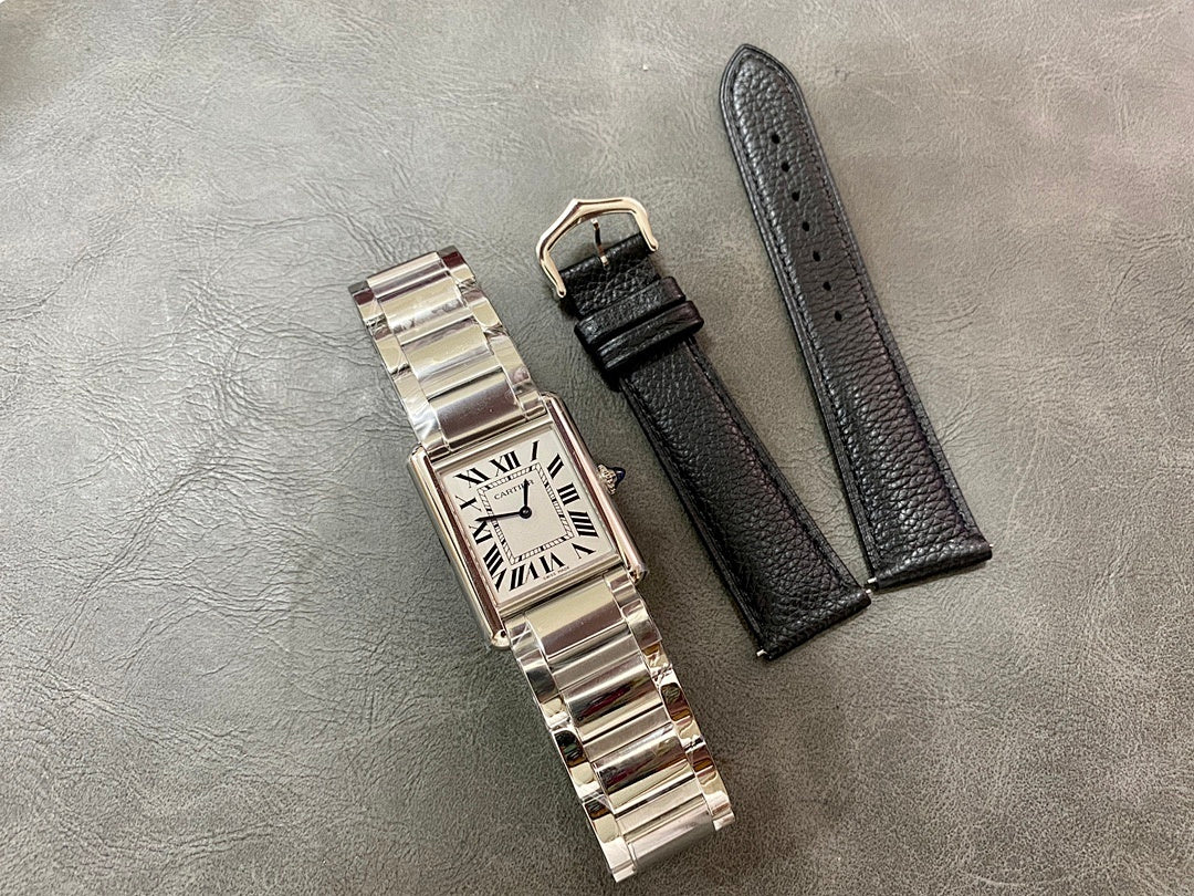 Rectangular stainless steel wristwatch with Roman numeral dial plus two black leather straps