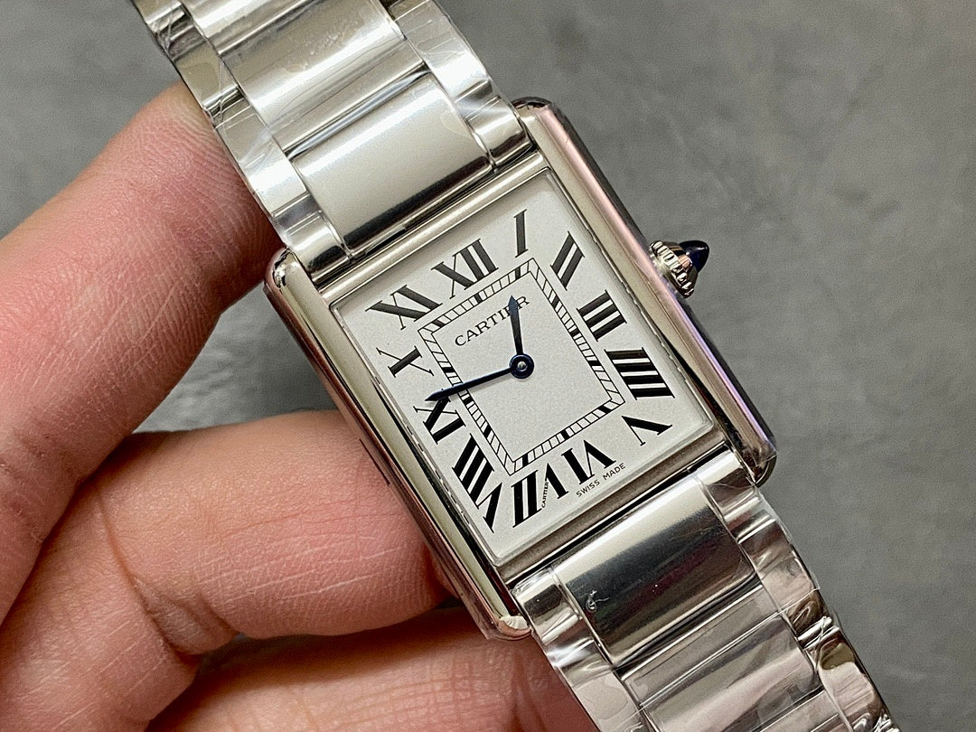 Rectangular stainless steel wristwatch front with Roman numeral dial and blue hands