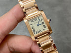 Gold-tone Cartier wristwatch with cream dial, Roman numerals, and blue seconds hand