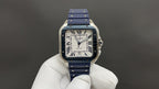Wristwatch with blue strap and gold-tone square face, Roman numerals and centered blue hands