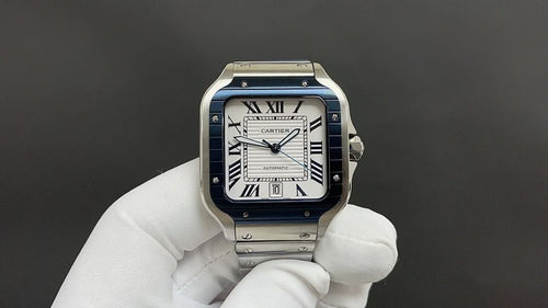 Cartier watch with blue dial, Roman numerals, stainless steel case and bracelet
