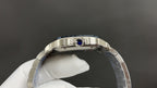 Cartier watch side view, stainless steel bezel with blue gemstone detail