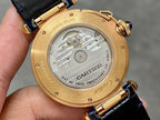 Cartier watch caseback in gold-tone with engraved details and attached blue leather strap